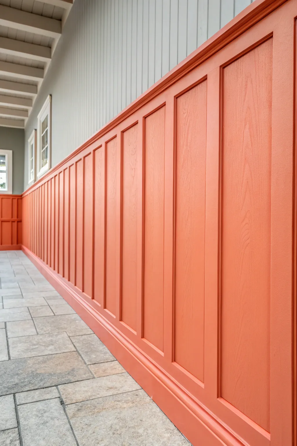 Elevate your space with a bold coral board and batten accent wall that celebrates craftsmanship and vibrant style.
