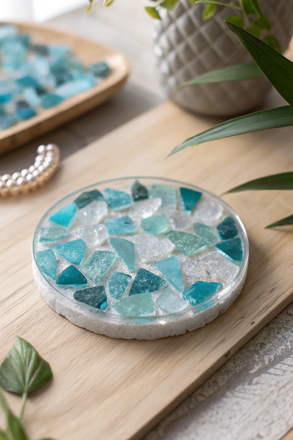 Elevate your coffee table with a splash of creativity: Handmade coasters crafted from broken glass and clear resin.