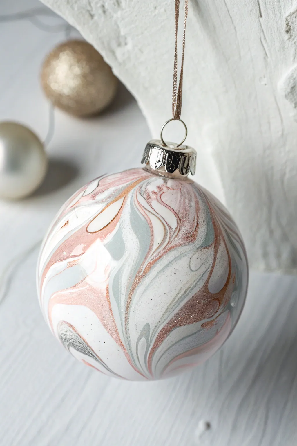 Add a touch of artistry to your holiday decor with these exquisite marbled ornaments.