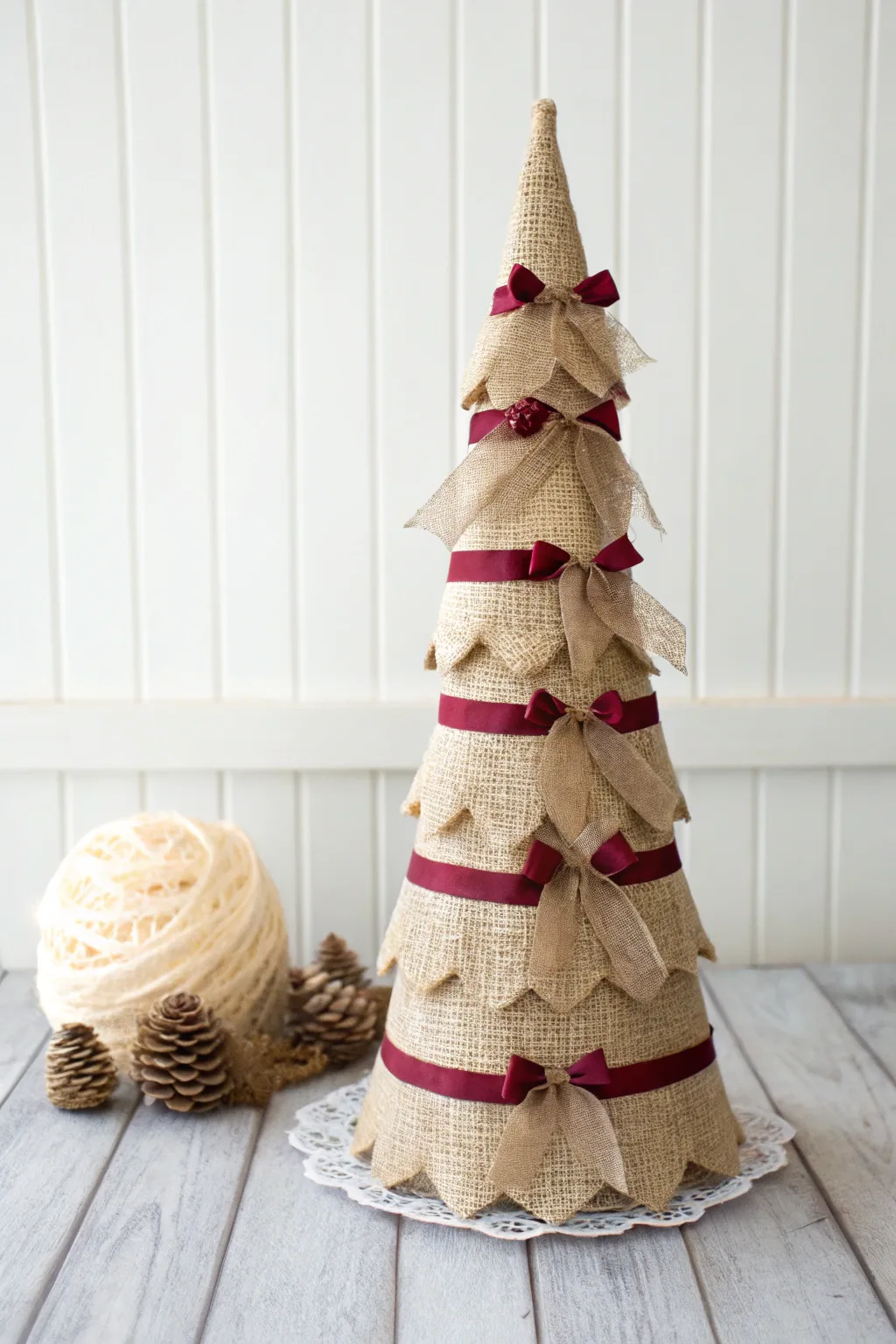 Embrace the rustic charm of the season with this minimalist burlap ribbon tree, where simplicity meets festive elegance.