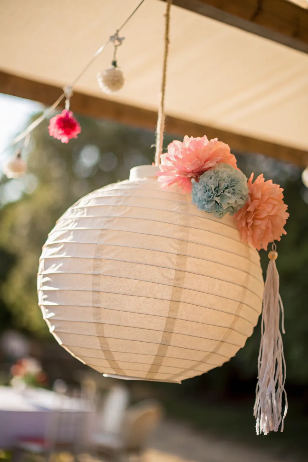 Elevate your celebrations with a touch of whimsy and elegance—discover the art of festive pom-pom paper lanterns.