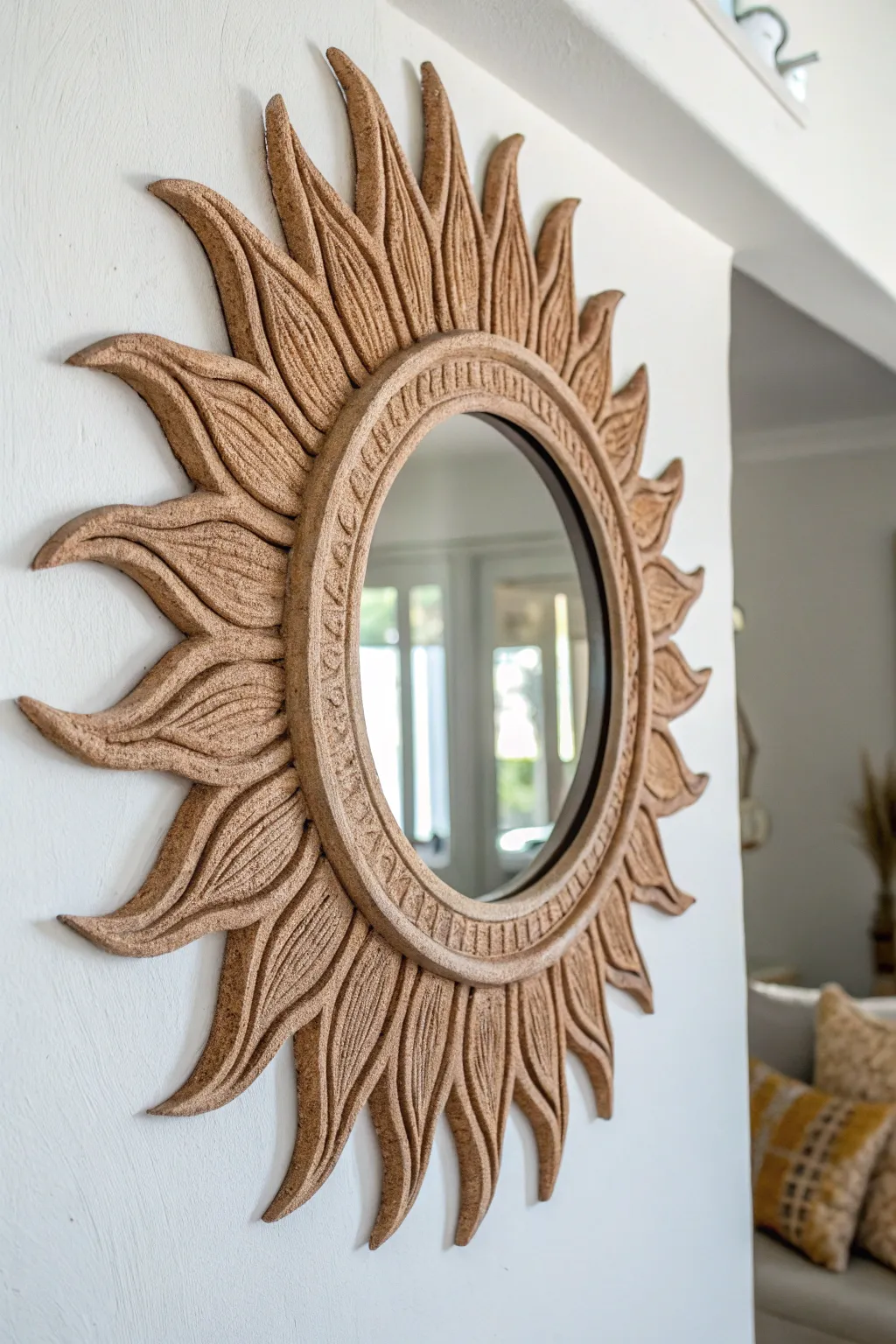 Embrace the artistry of simplicity with a clay-framed sunburst mirror, where natural beauty meets minimalist elegance.