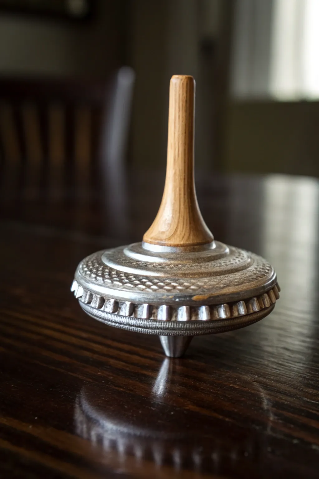 Experience the art of motion with this handcrafted spinning top, where simplicity meets craftsmanship.