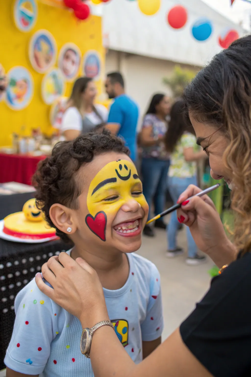 Emoji face painting brings smiles and creativity to the party.