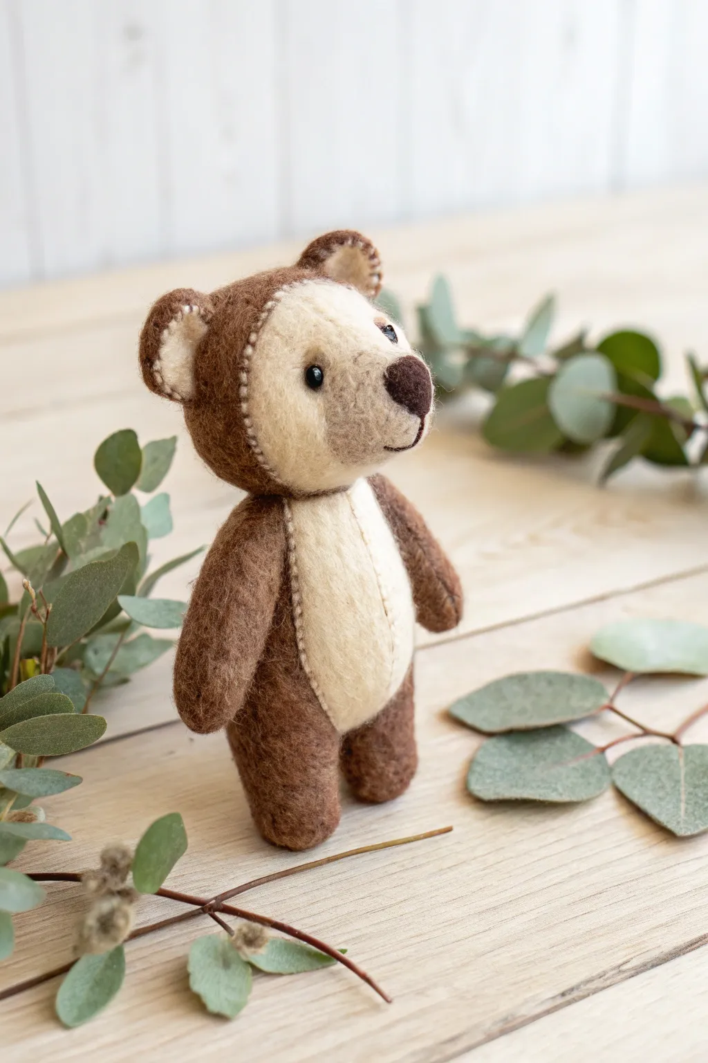 Embrace the wild and whimsical with this charming felt bear, perfect for adding a touch of adventure to your decor.