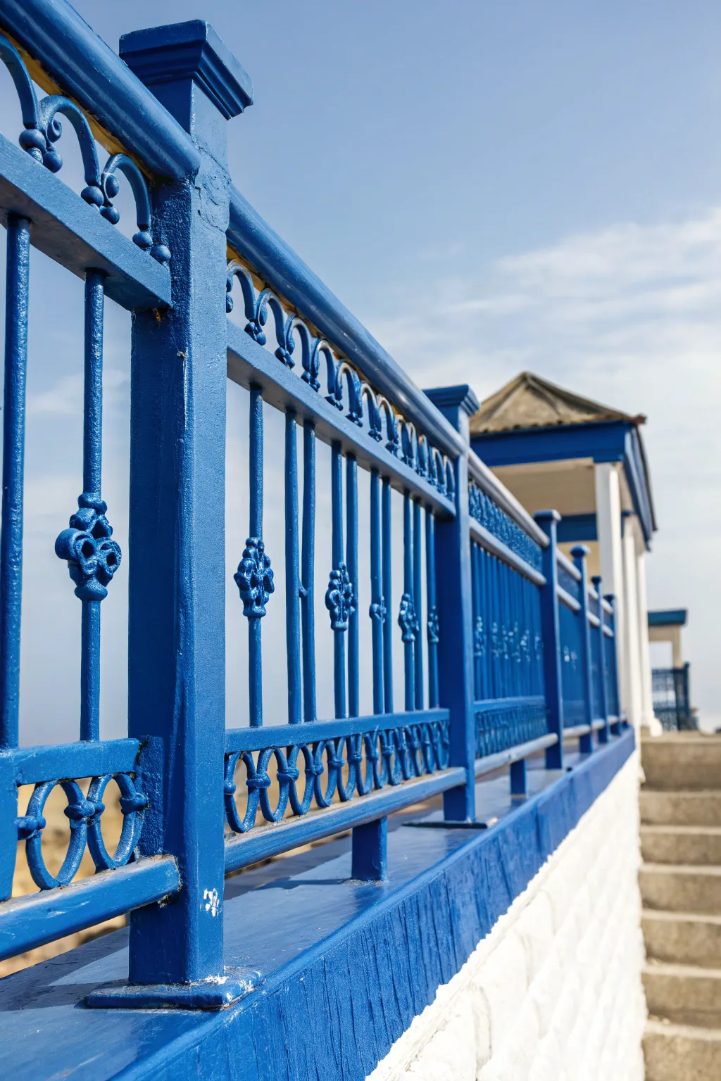 Make a bold statement with vibrant cobalt blue railings that transform your rooftop space.