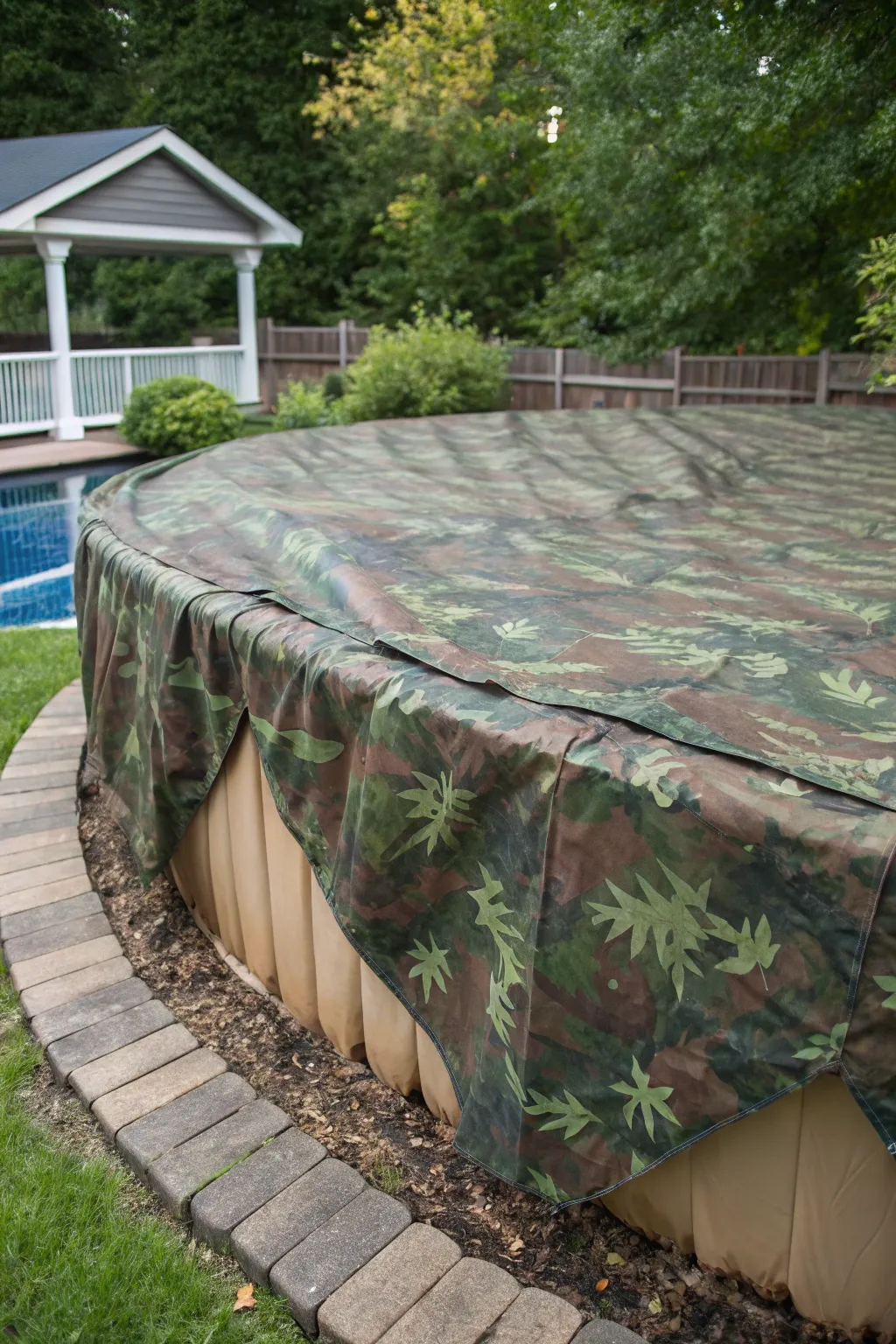 Seamlessly blend your pool into nature with a handcrafted camouflage cover.