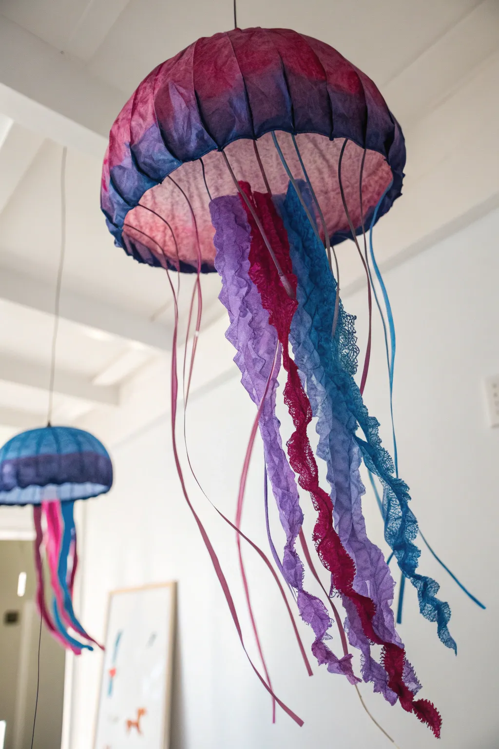 Dive into creativity with this stunning tissue paper jellyfish, where bold colors meet minimalist elegance.
