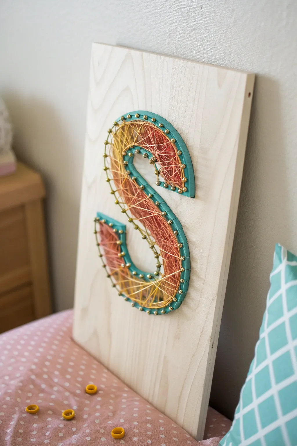 Transform simplicity into standout art with this vibrant string art 'S'. Perfect for adding a touch of personalized elegance to your space.
