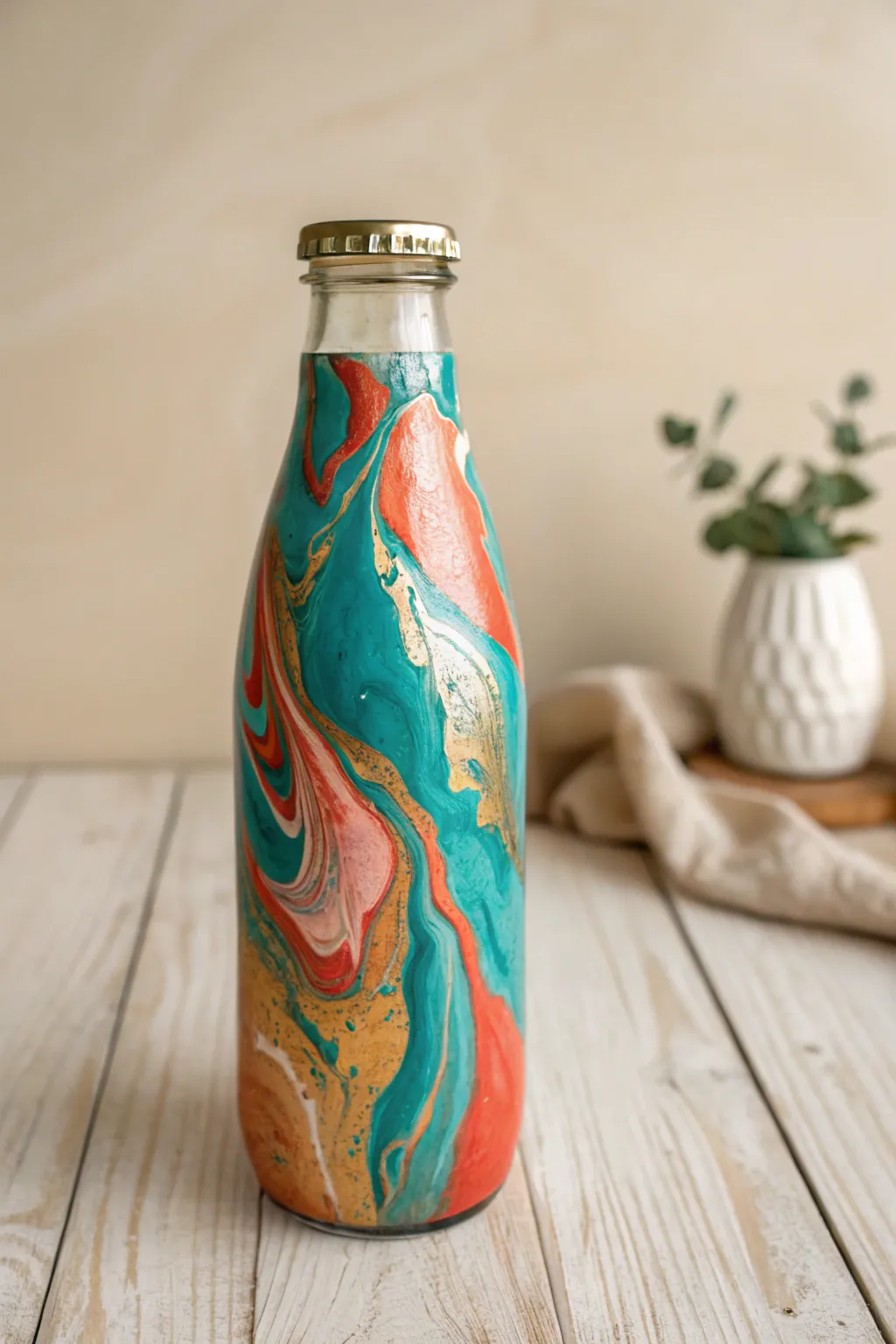 Transform old glass bottles into stunning abstract art with paint pouring techniques. #DIYDecor #MinimalistBoho
