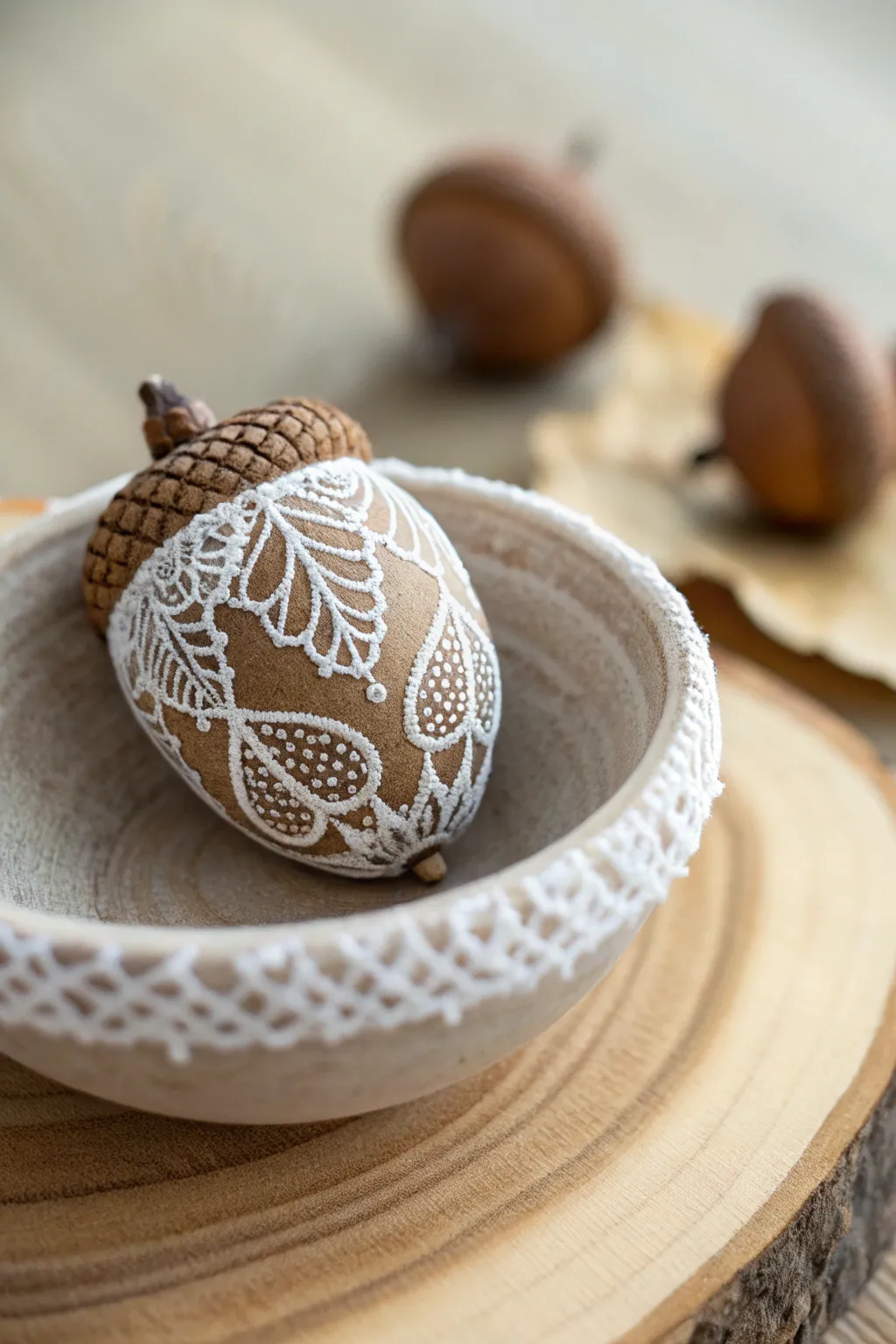 Elevate your decor with the delicate charm of lace-painted acorns.
