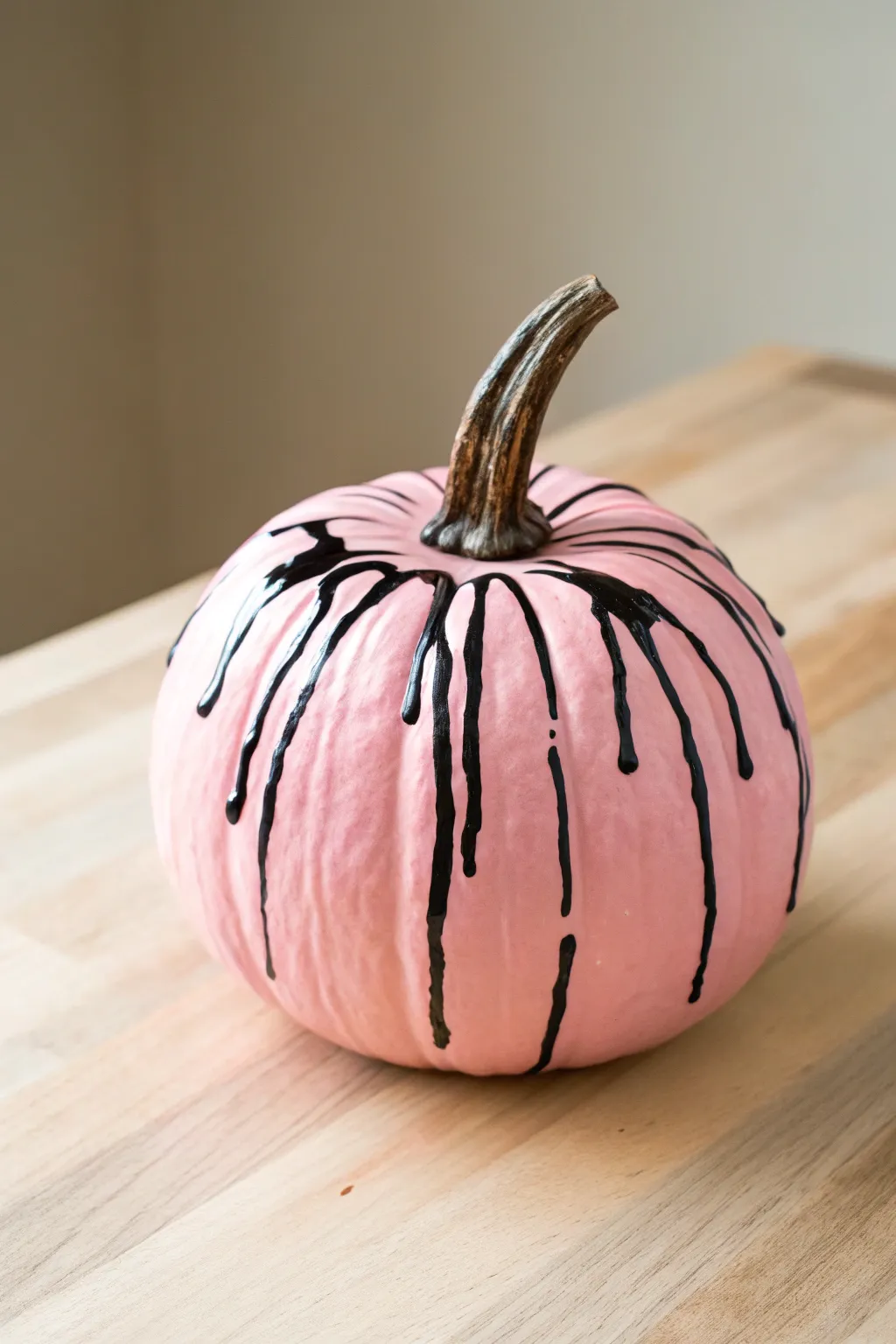 Elevate your autumn decor with a pink pumpkin featuring a dramatic drip effect – where minimalist meets bold!