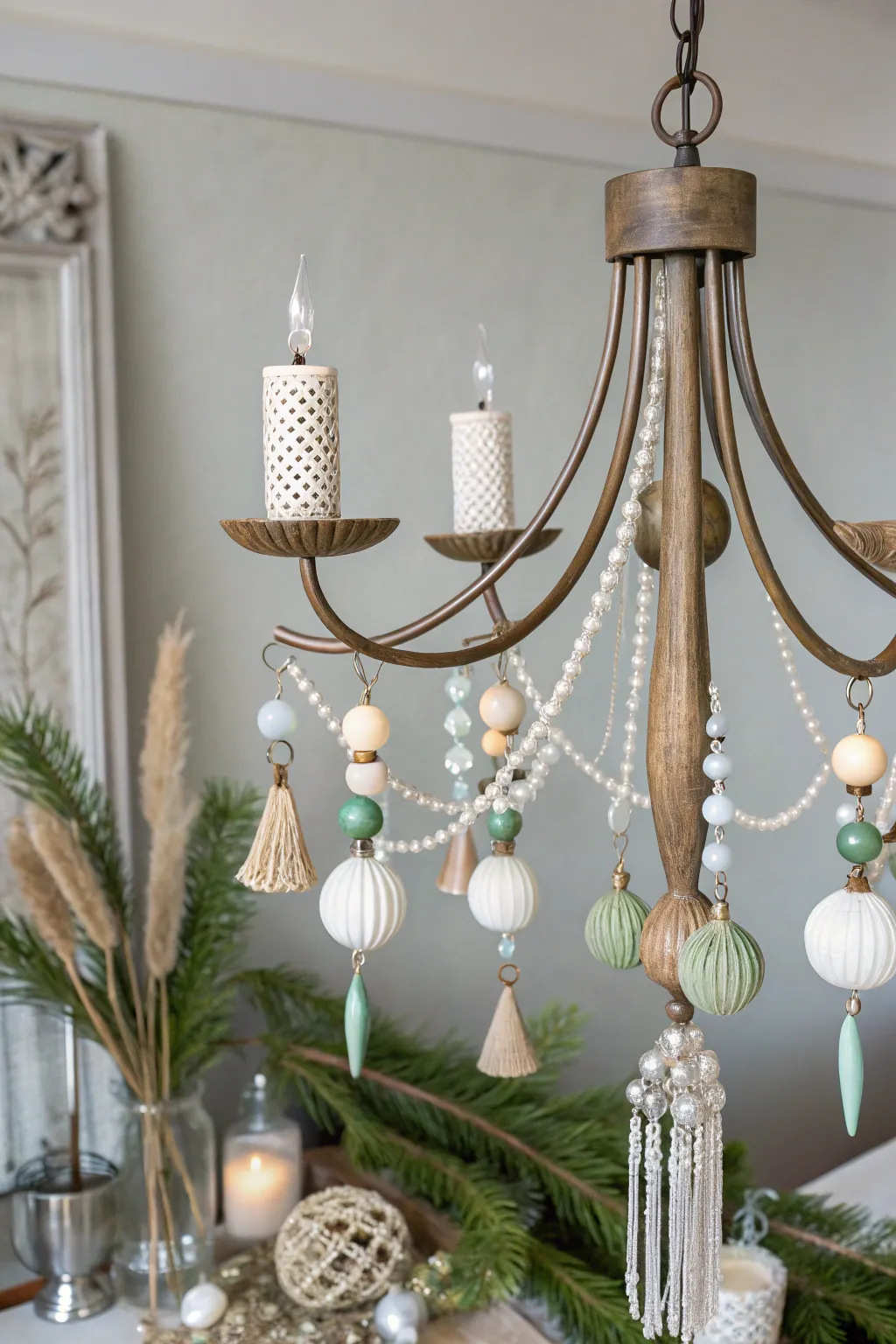 Transform your space with a touch of festive elegance: a minimalist chandelier adorned with handcrafted holiday ornaments.