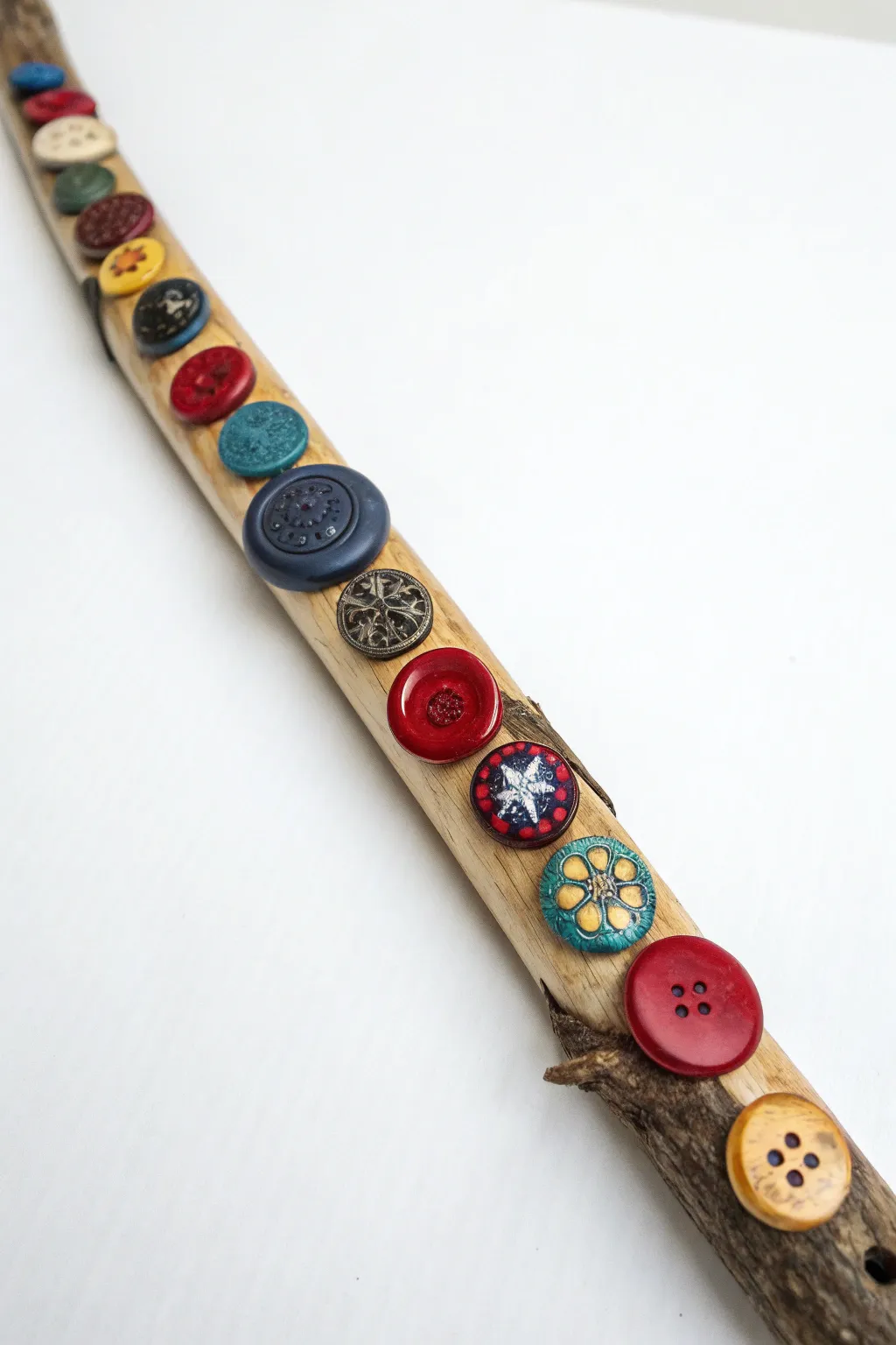 Embrace vintage charm with this eclectic Button Bonanza spirit stick!