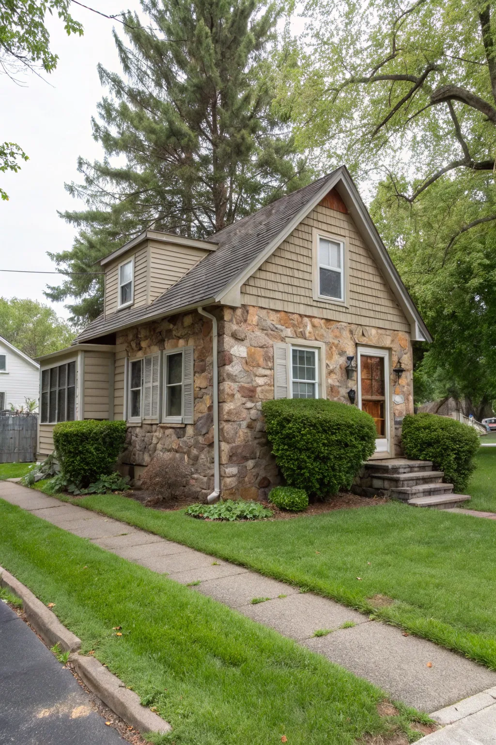 Vinyl siding mimicking stone adds luxury.