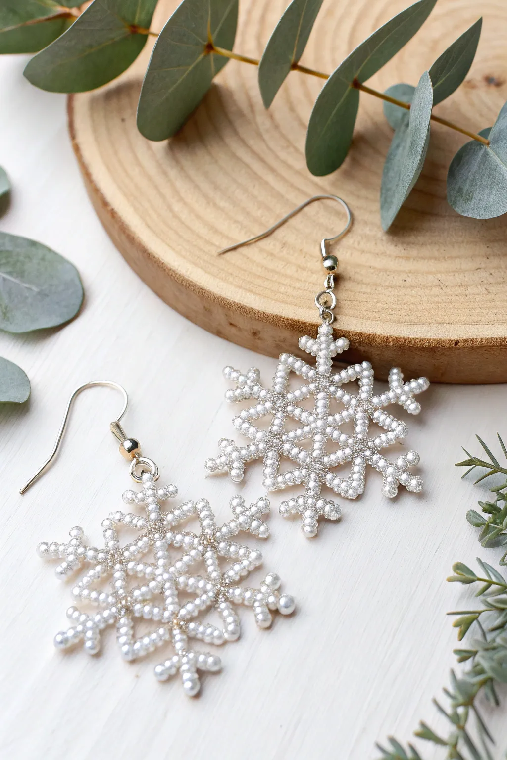 Add a touch of festive sparkle to your holiday wardrobe with these beautifully crafted snowflake earrings.