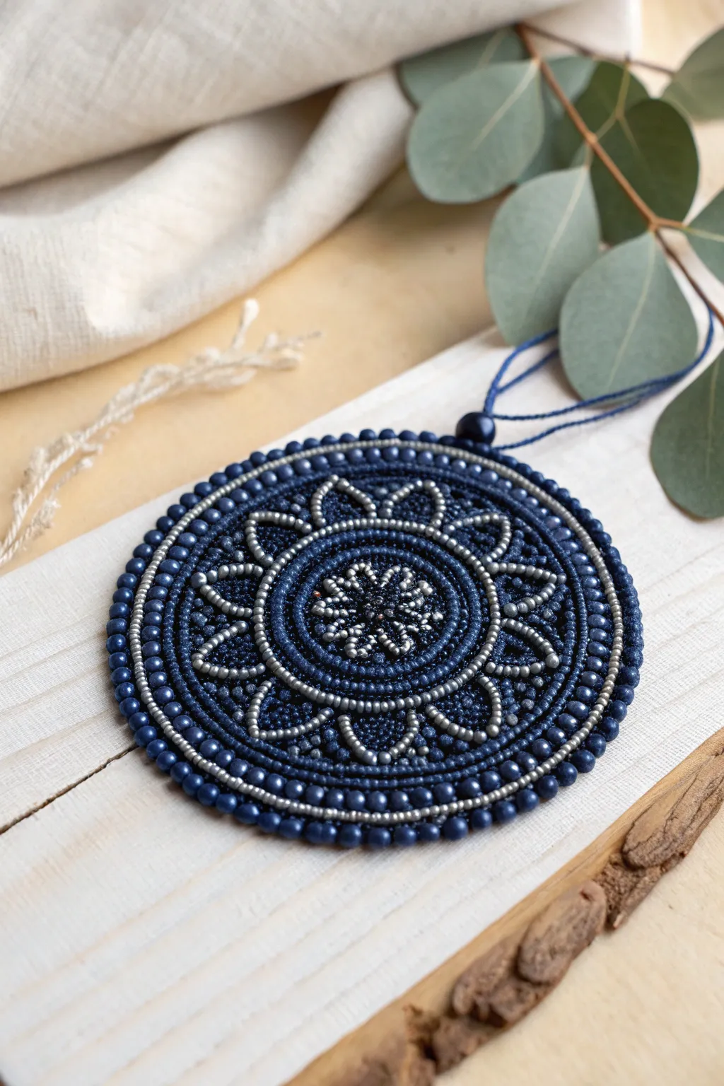 Dive into the elegance of monochrome with this stunning beaded medallion, perfect for adding a touch of sophistication to your minimalist decor.
