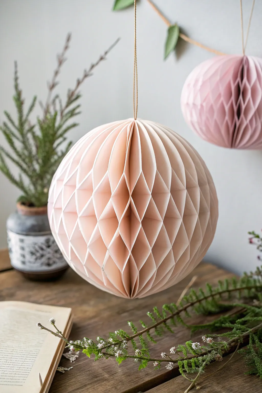 Elevate your holiday decor with stunning DIY paper honeycomb ornaments that blend minimalist design with a Boho twist.