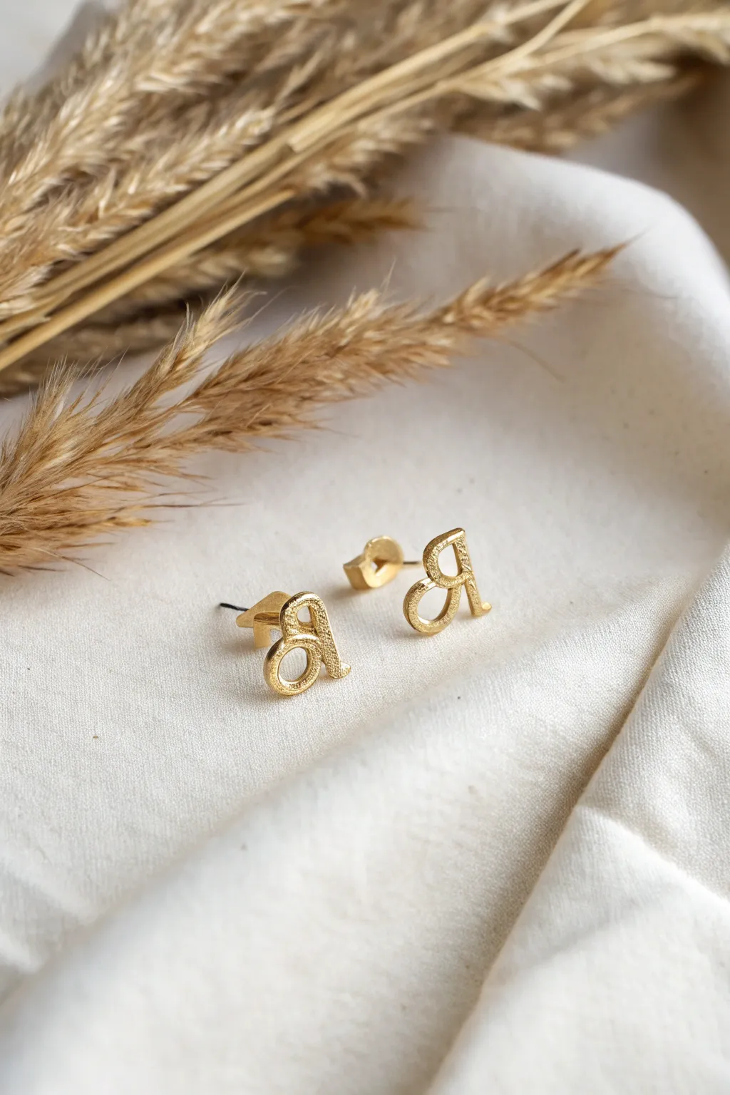 Elevate your style with personalized initial studs - the perfect blend of simplicity and charm.