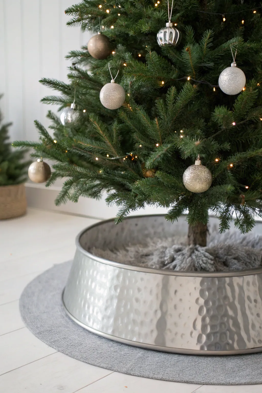 Elevate your holiday decor with a chic metallic tree collar for a modern twist on tradition.