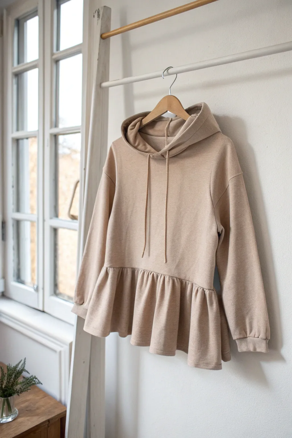 Elevate your hoodie style with a chic peplum flair – where simplicity meets elegance.