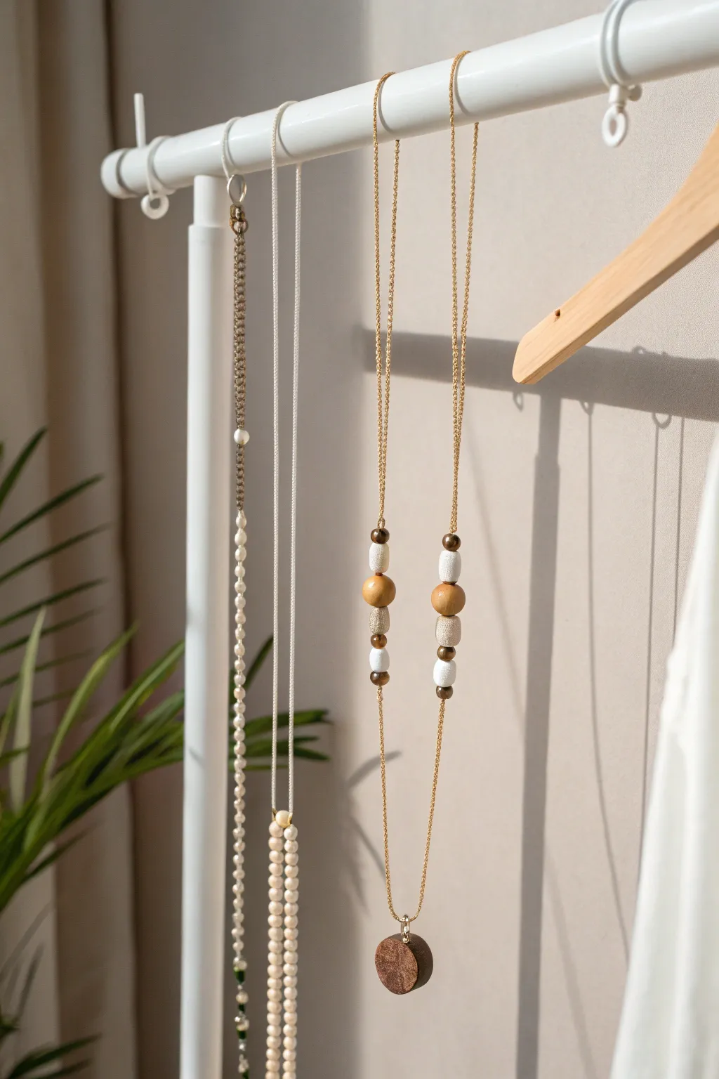 Elevate your jewelry display with this minimalist hanging rod and string system, where simplicity meets natural elegance.