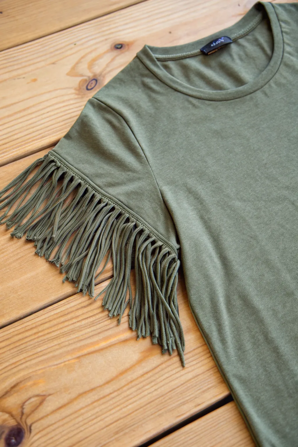 Add a playful twist to your look with fringe sleeves! Perfect for a festival-ready vibe. #DIYFashion #BohoChic