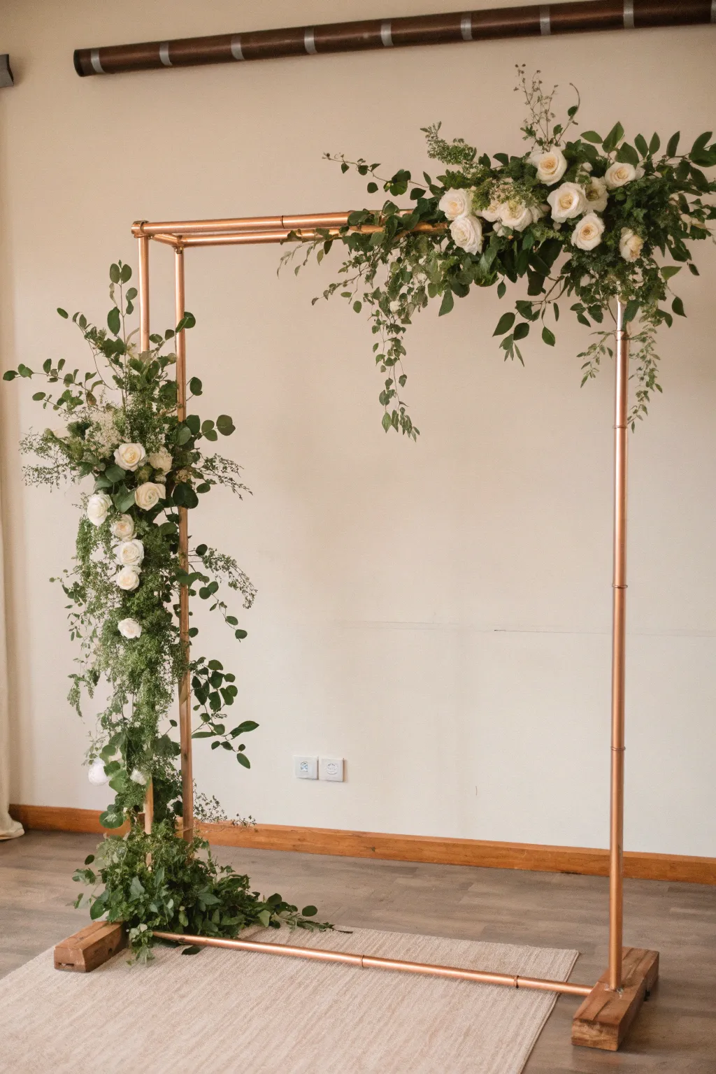 Transform your wedding with this chic copper pipe backdrop, where industrial meets elegance.