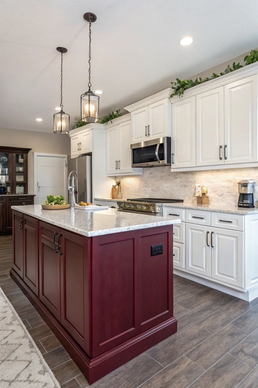 A kitchen showcasing a rich burgundy island that offers luxurious contrast to white cabinets.