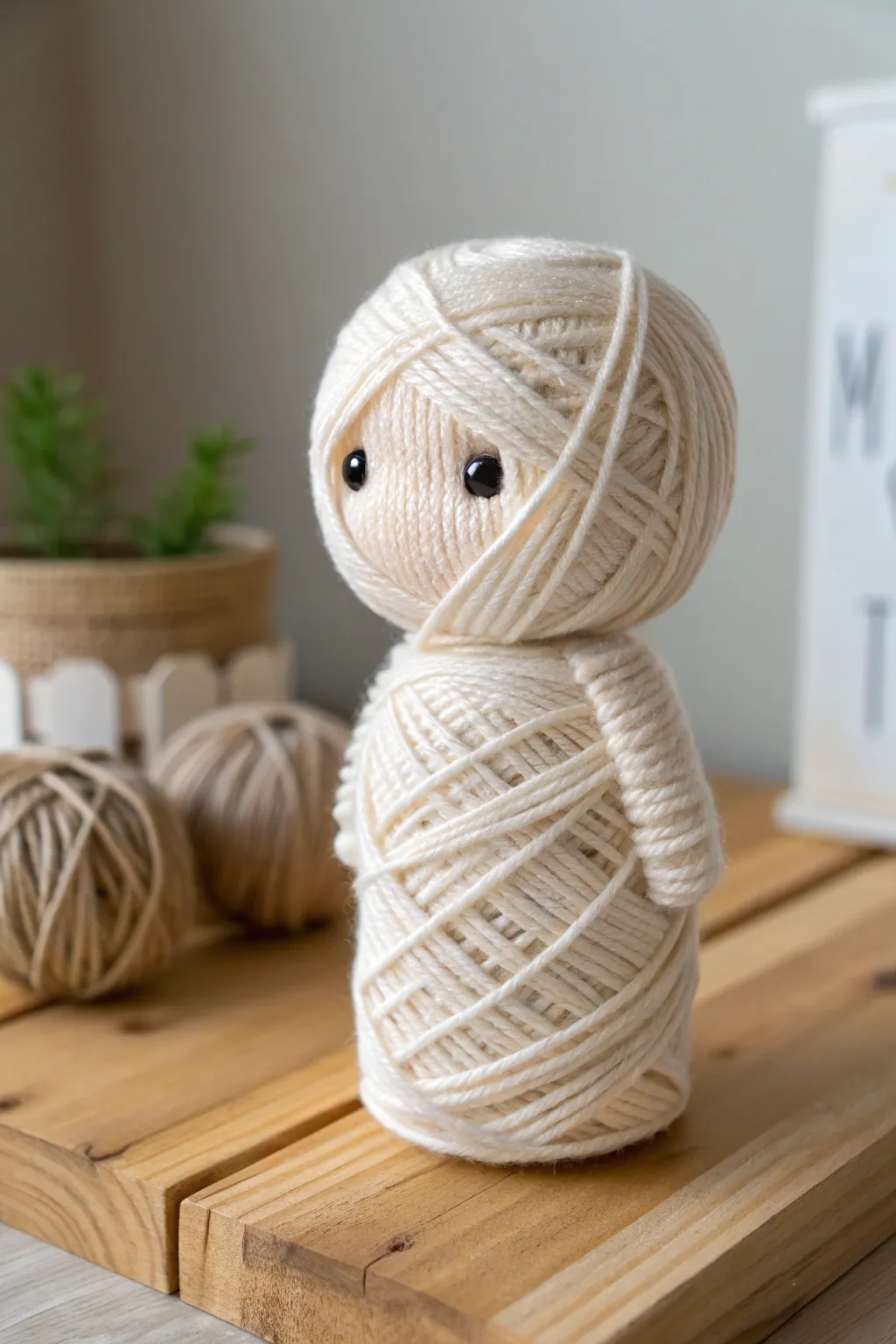 Elevate your Halloween decor with this charming yarn mummy garland, where simplicity meets craft elegance.