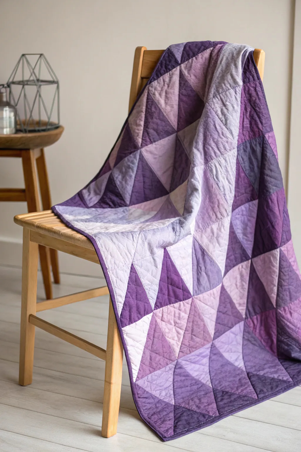 Embrace the art of abstraction with a stunning purple quilt that adds a touch of creativity and elegance to any space.