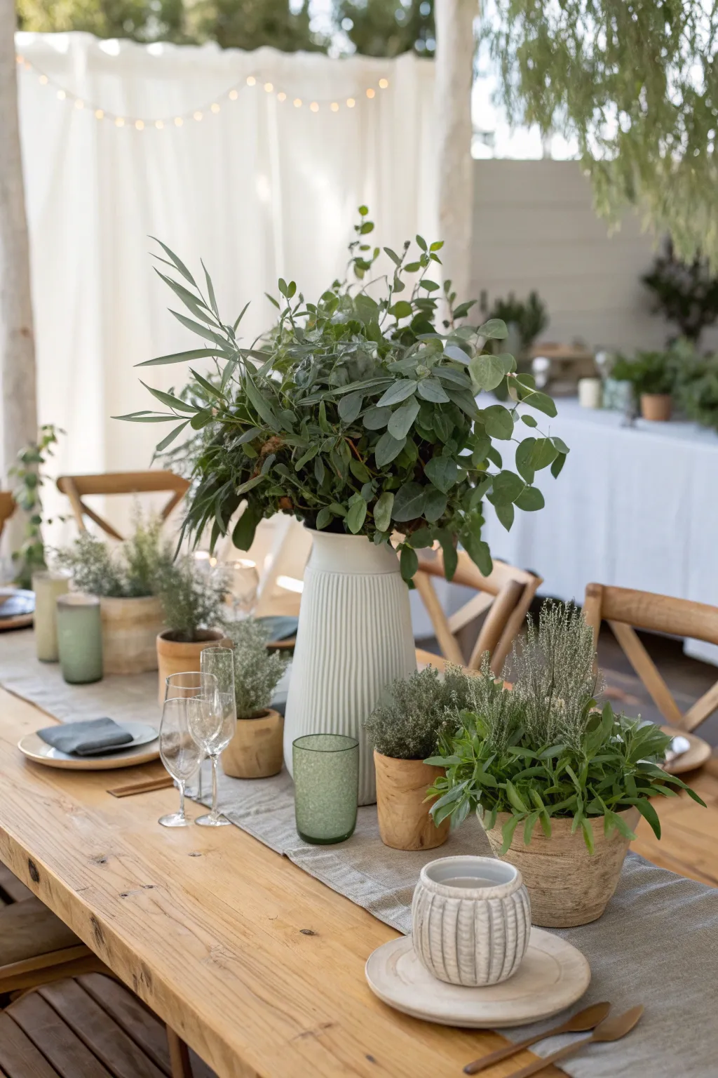 Eco-friendly greens and potted plants offer a sustainable and chic centerpiece option for your celebration.