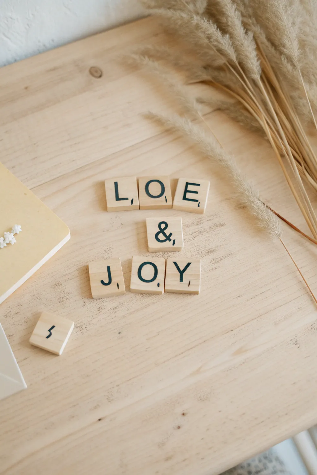 Spell out your wishes with style: Scrabble tile sentiments for your wedding guest board.