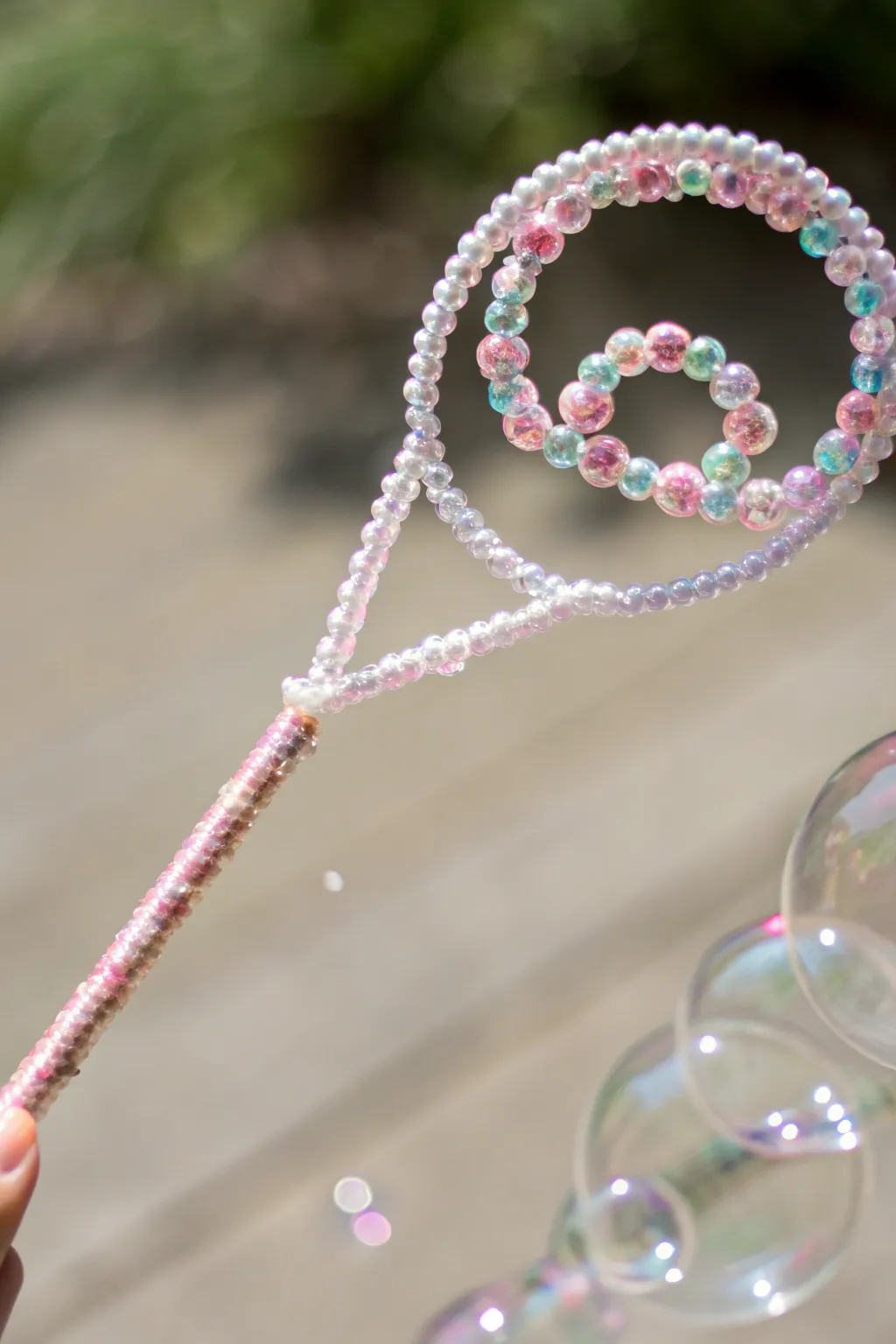 Create mesmerizing bubbles with this elegant DIY bead-adorned wand, perfect for your next gathering.