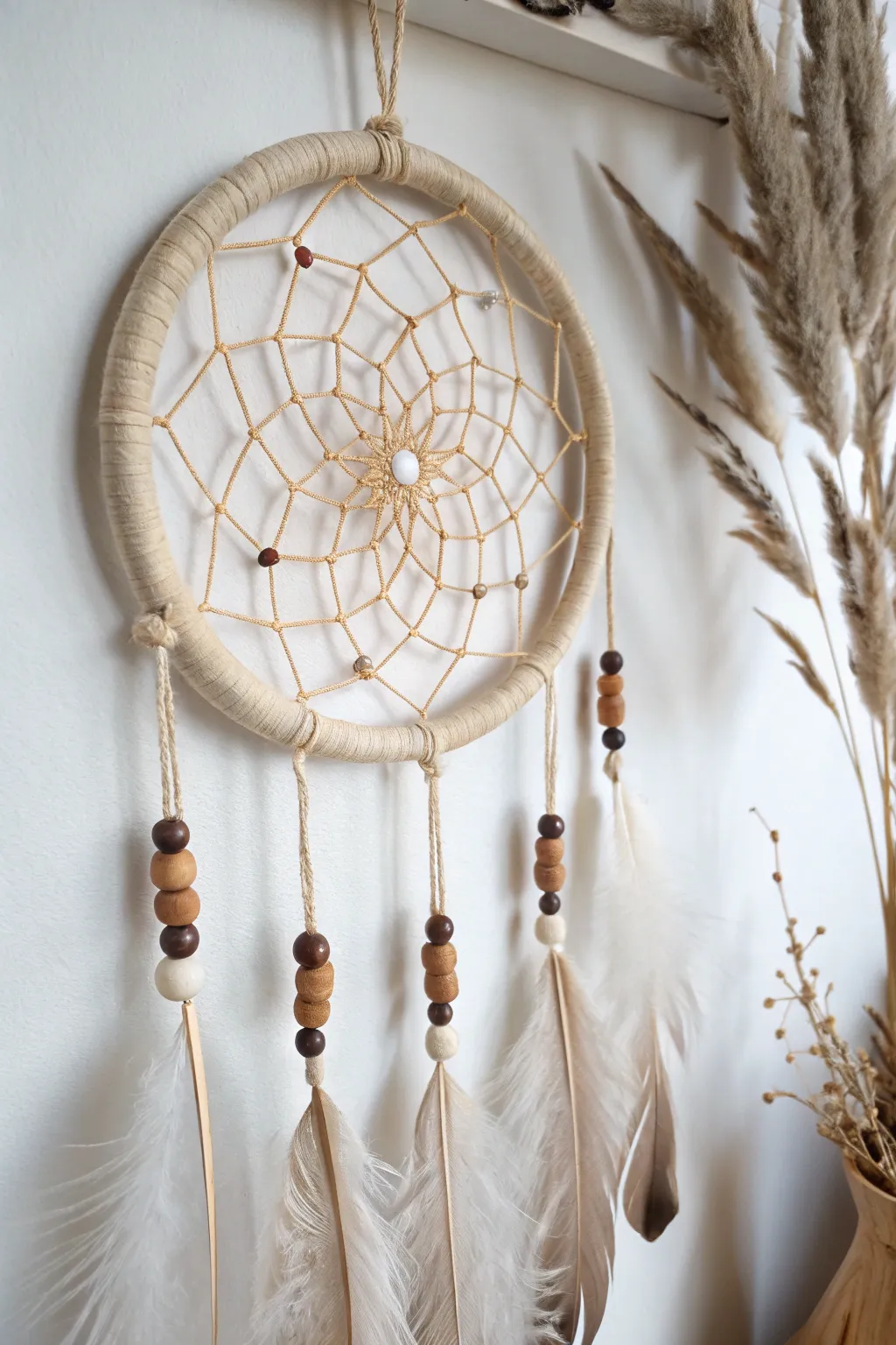 Craft a touch of bohemian charm with this elegant DIY dreamcatcher, perfect for adding warmth and style to any space.