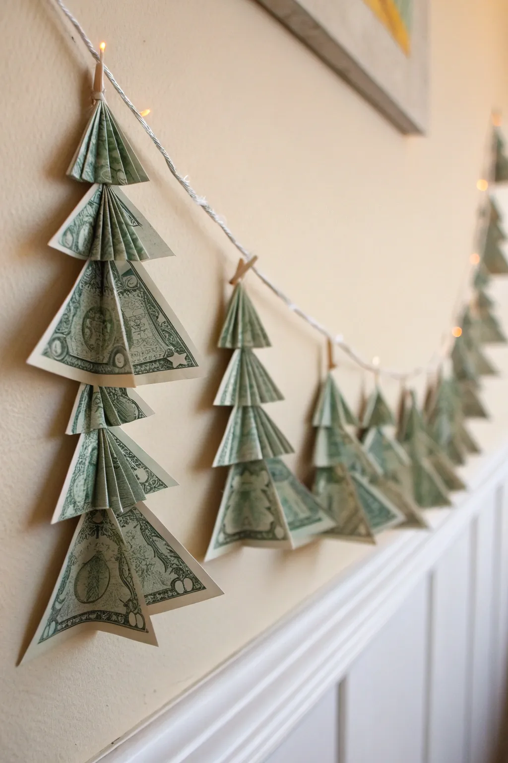 Transform your space with a touch of festive elegance: a dollar bill origami Christmas tree garland.