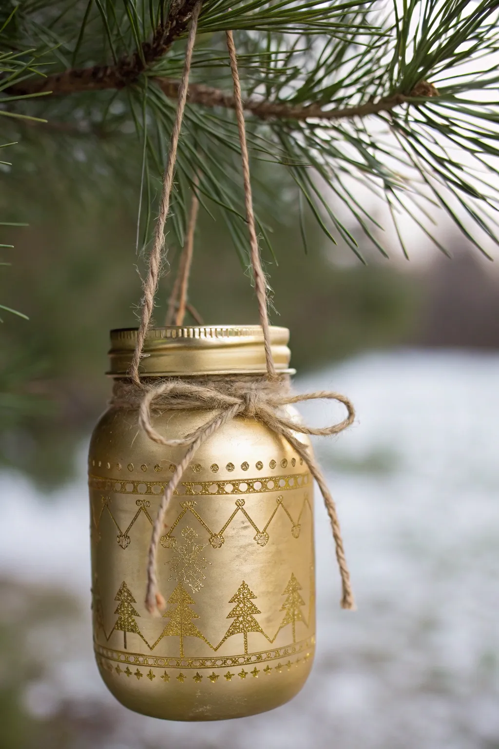 Elevate your holiday decor with a touch of glamour: DIY metallic mason jar ornaments.