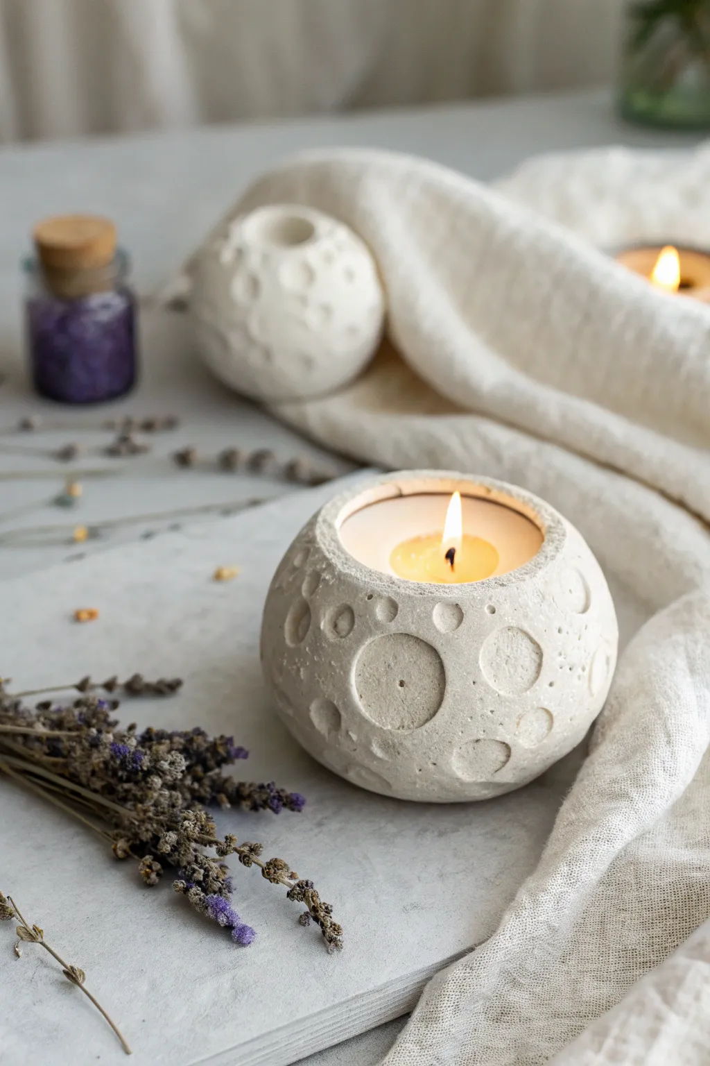 Illuminate your space with the tranquil beauty of a handmade lunar-inspired candle holder.
