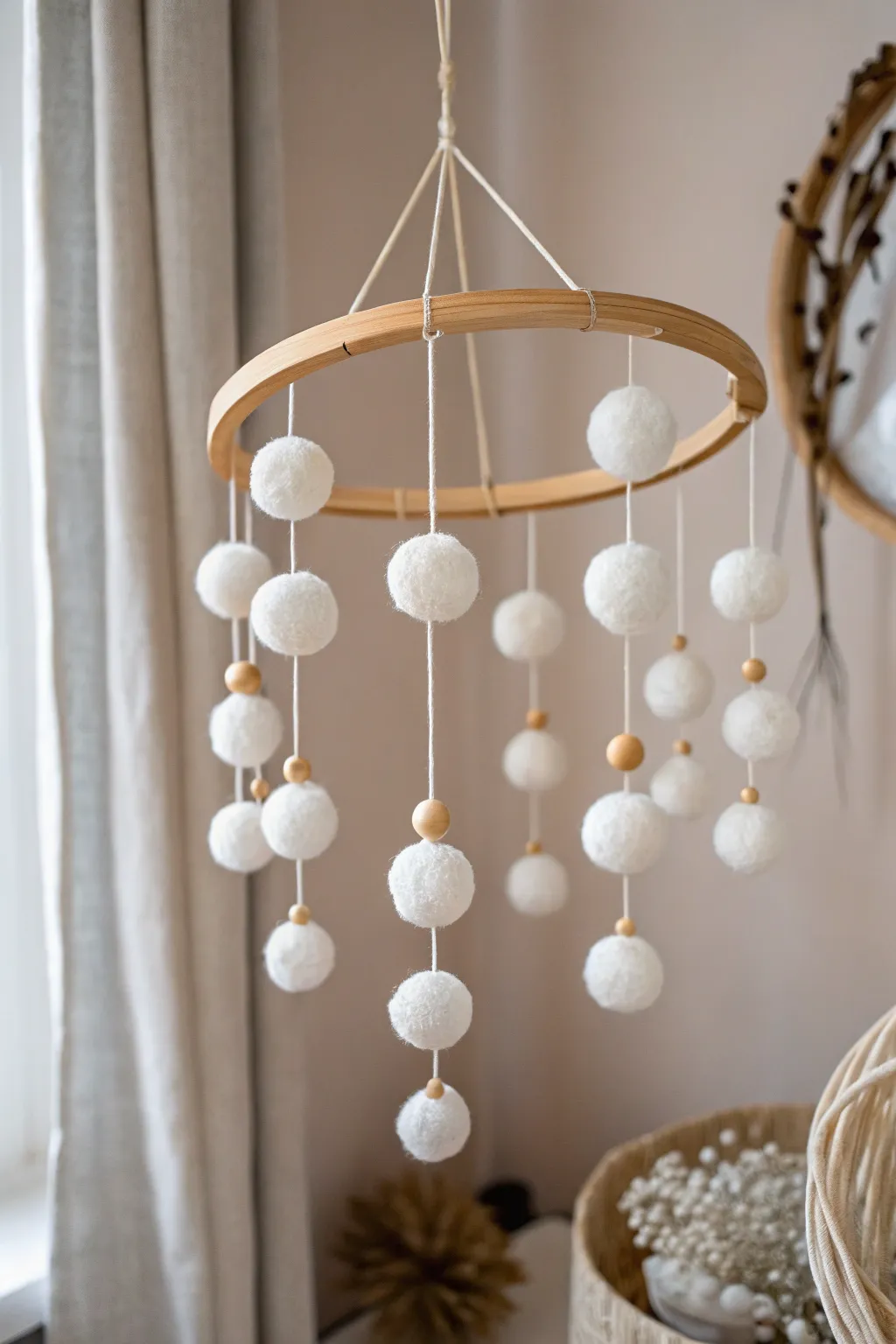 Elevate your space with a charming snowball mobile, where simplicity meets playful elegance.