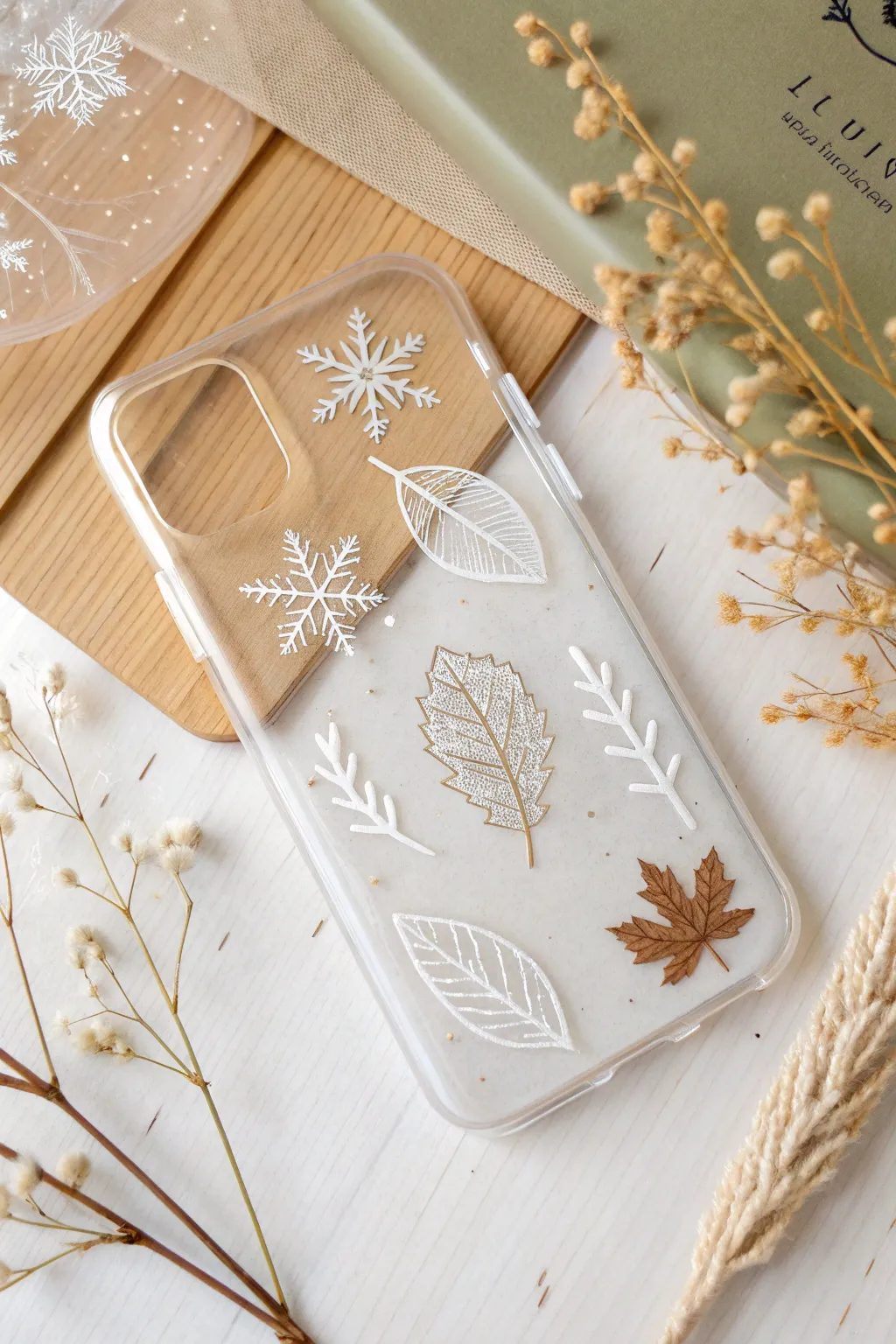 Embrace the changing seasons with ethereal phone case designs, where autumn leaves meet winter's first snowflakes.