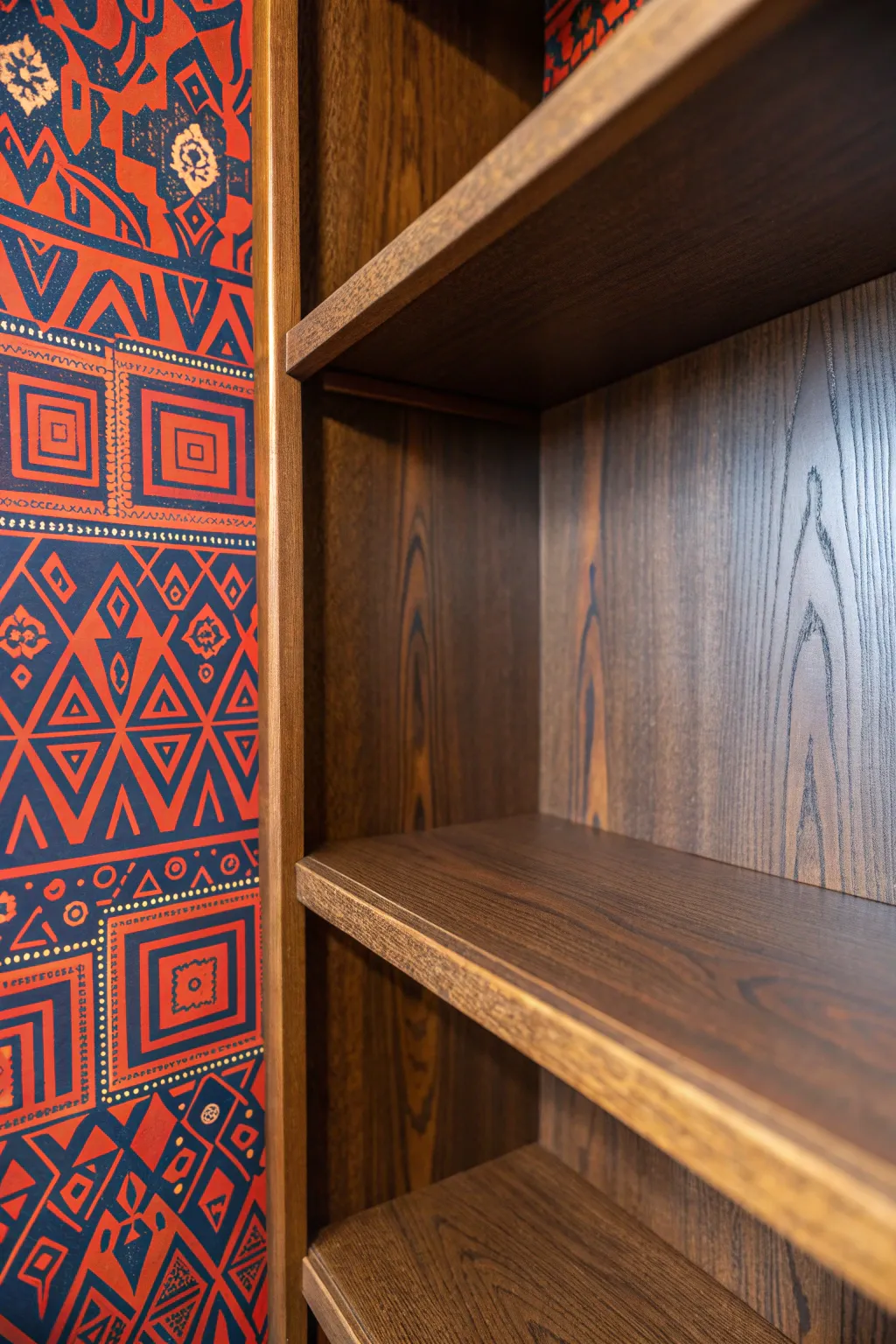 Transform your closet with a pop of personality using bold-patterned wallpaper.