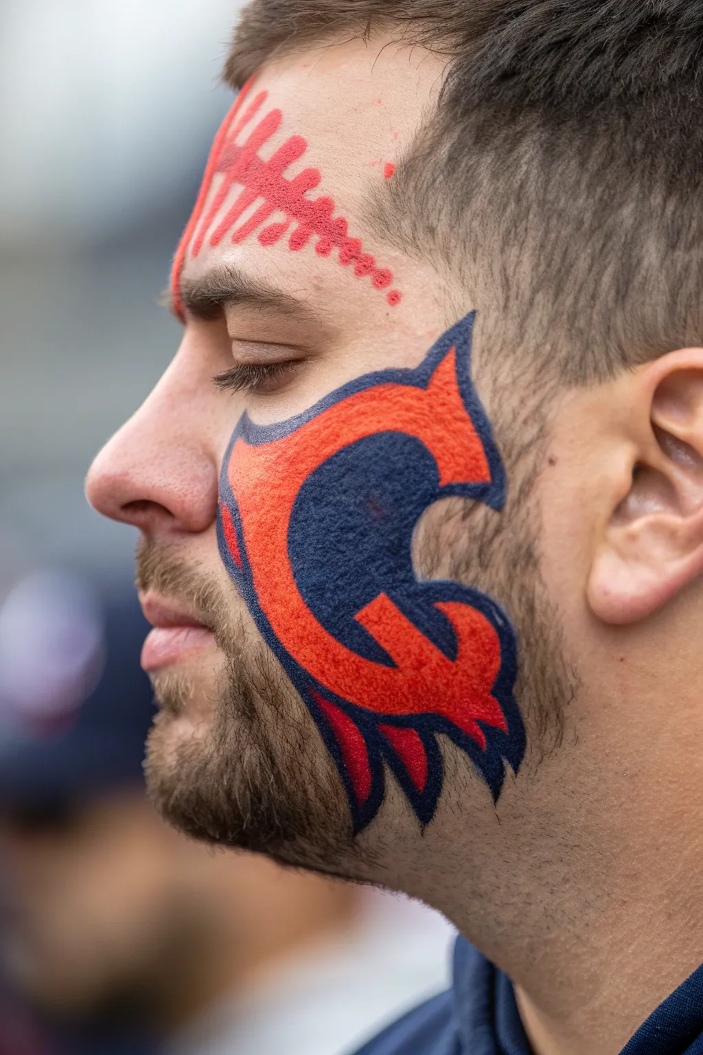 Wear your pride: A bold team logo face paint for game day glory.