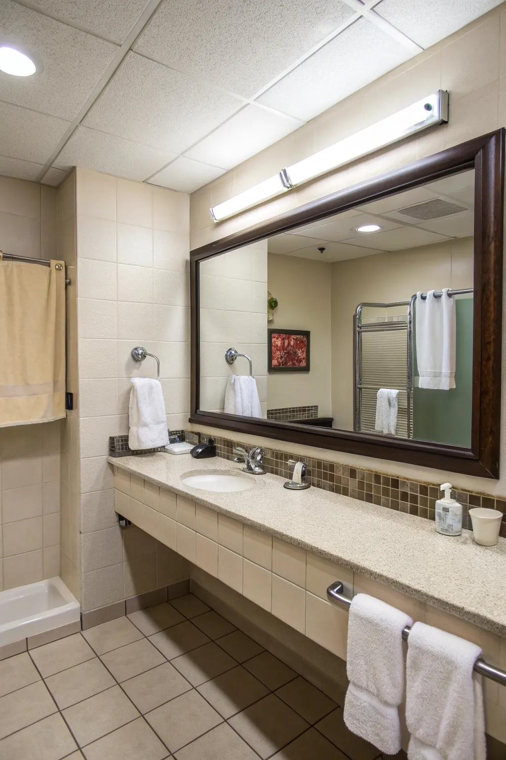 Functional hooks help keep the guest restroom tidy and organized.