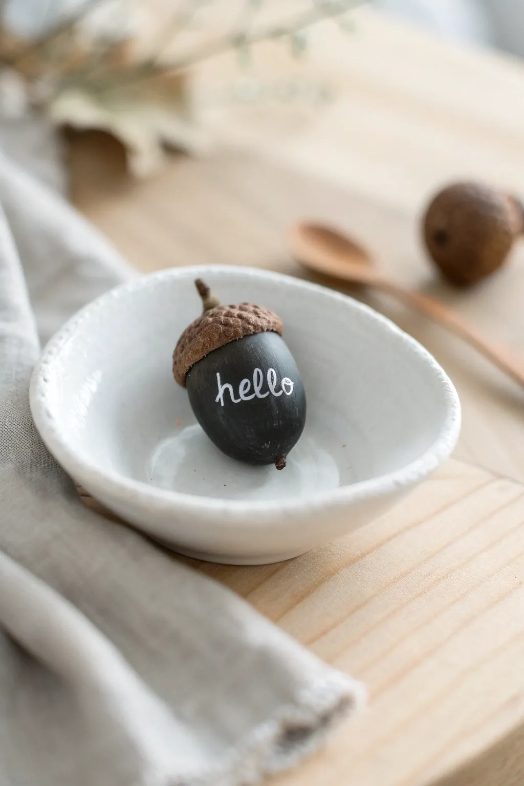 Transform nature into art with these adorable chalkboard acorns, perfect for adding a personal touch to any space!