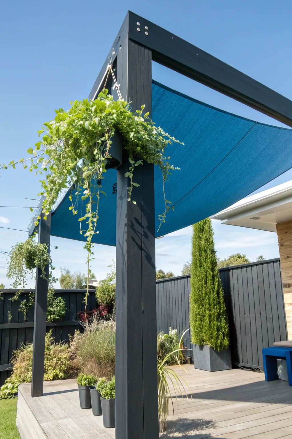 Elevate your outdoor space with stylish shade and greenery fusion.