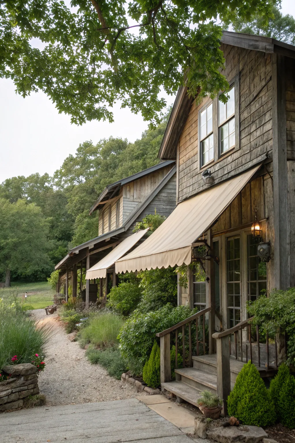 Reclaimed material awnings add sustainable character to this farmhouse.