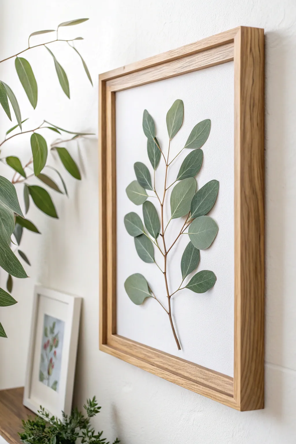 Bring the tranquility of nature indoors with framed eucalyptus elegance.