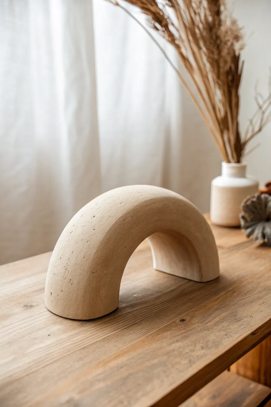 Embrace the elegance of simplicity with this stunning minimalist clay arc sculpture.