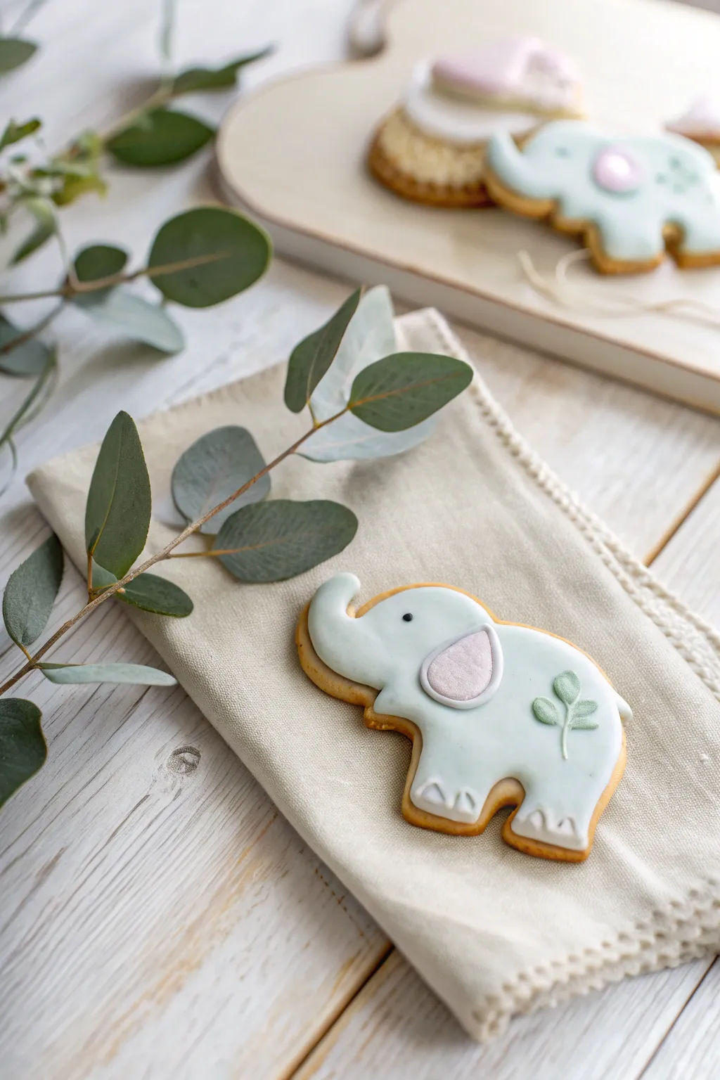 Charming baby elephant cookie with a heartwarming touch, perfect for your minimalist baby shower!