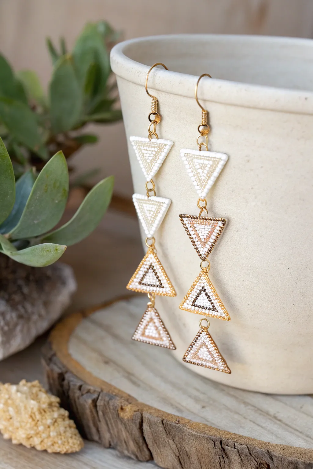 Discover the elegance of symmetry with these handcrafted geometric earrings, where minimalist design meets bohemian charm.